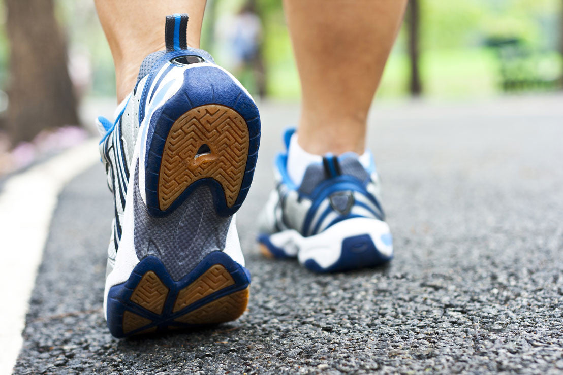 Someone walking on pavement in sneakers