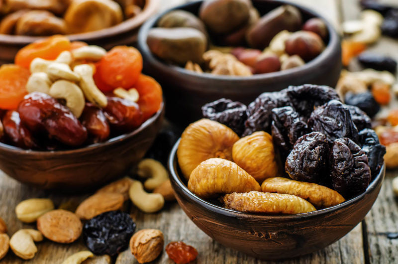 Bowls of nuts and dried fruit