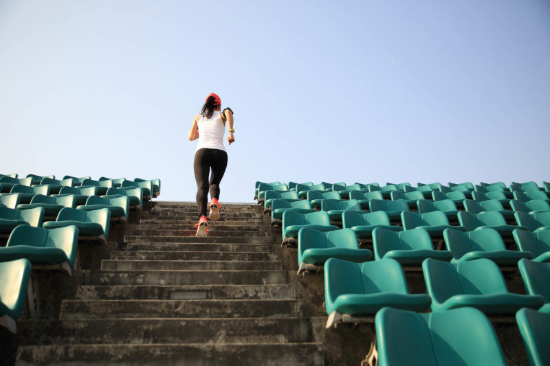 Woman running up stiars