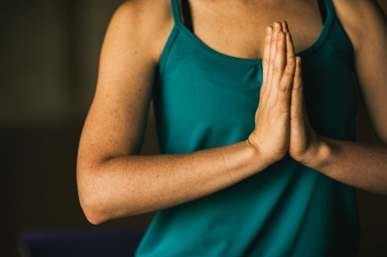 Woman with hands in prayer