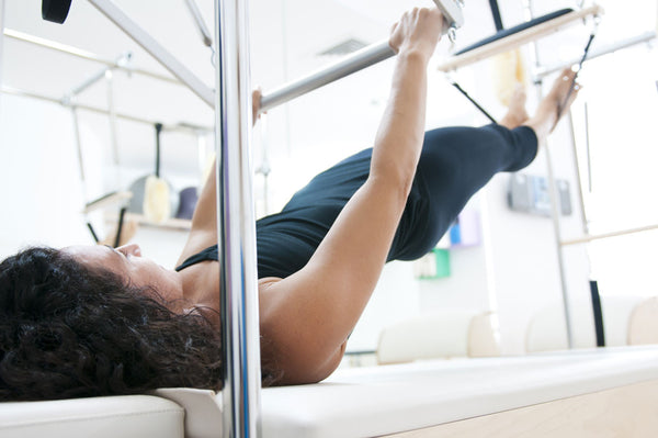Should You Do Pilates on a Mat or on a Reformer? - Gaiam