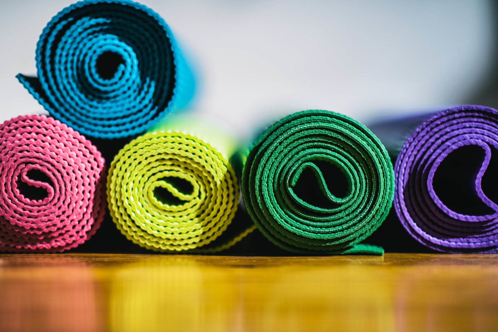 Stack of colorful yoga mats