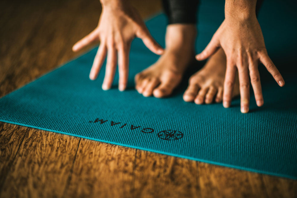 Forward fold on Gaiam yoga mat