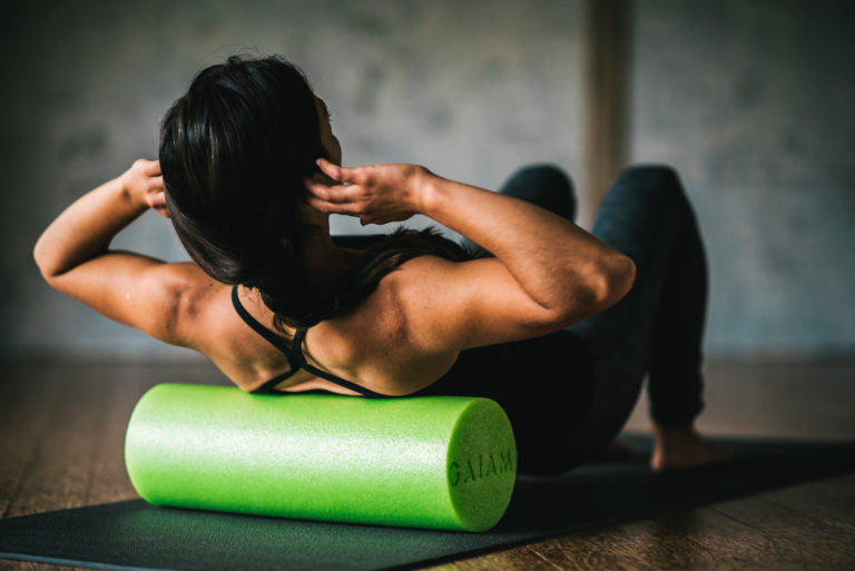 Woman using a foam roller