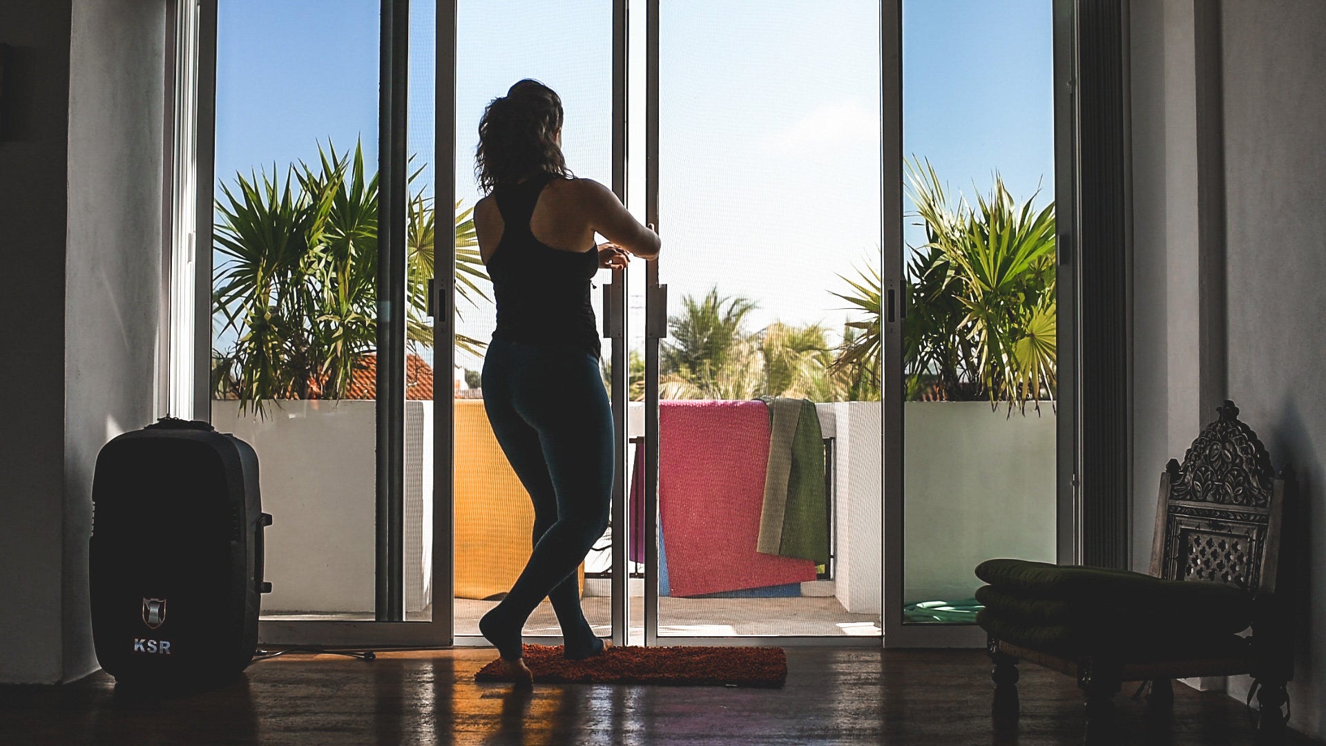 Woman opening doors to outside