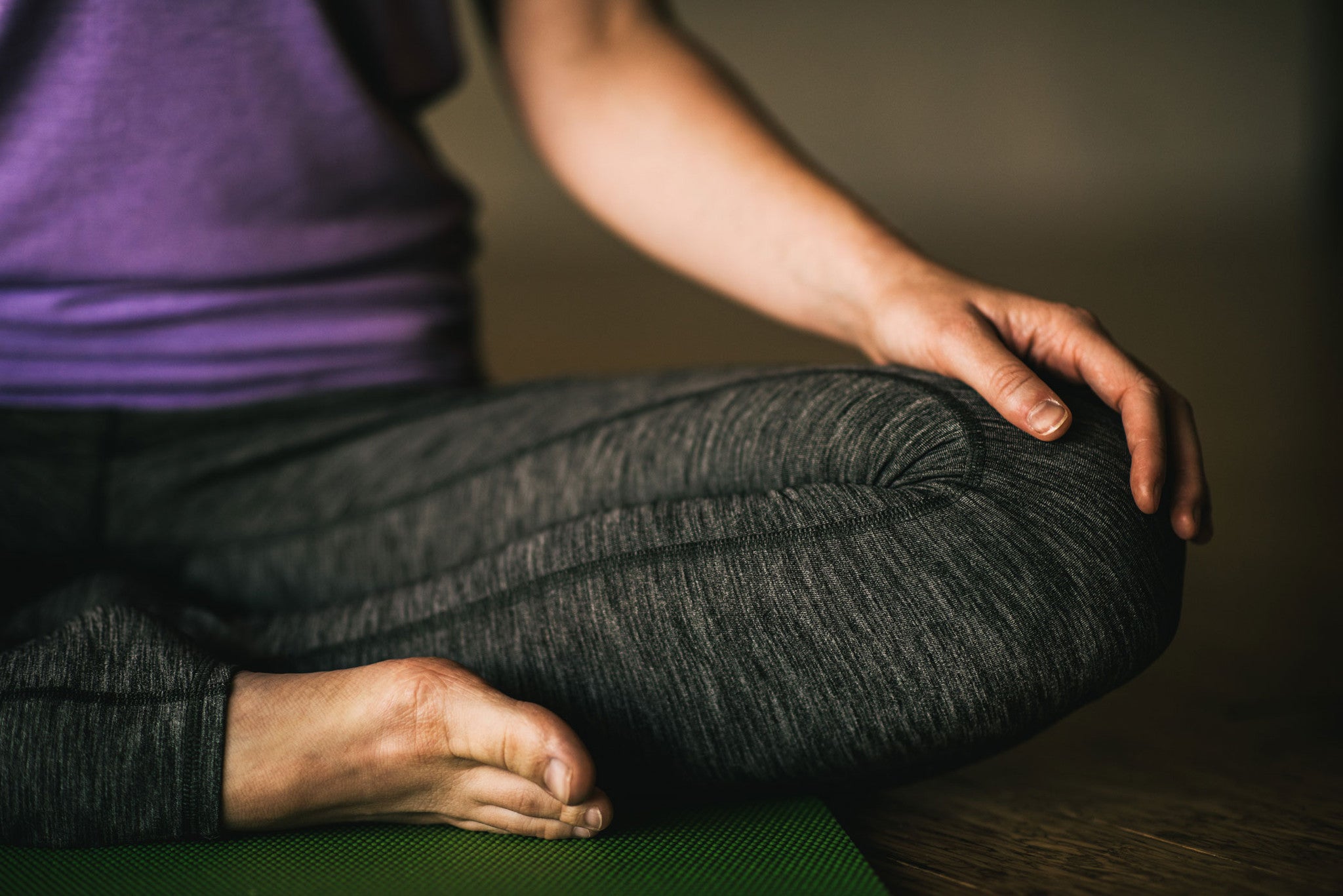 Woman sitting cross-legged