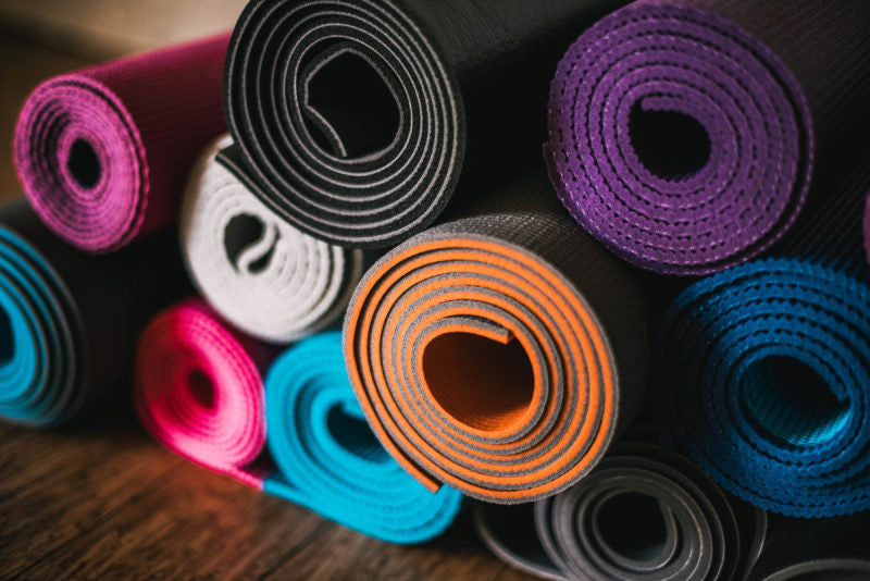 Stack of colorful yoga mats