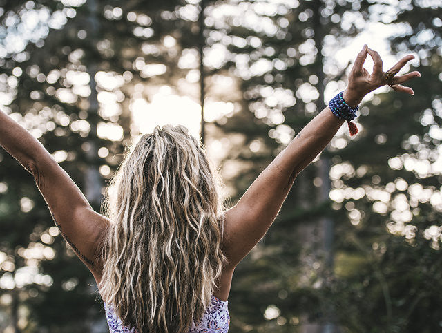 Woman with arms spread wide