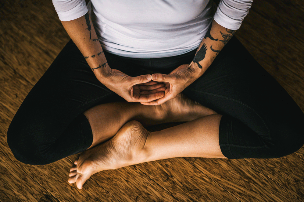 Woman sitting in meditation posture