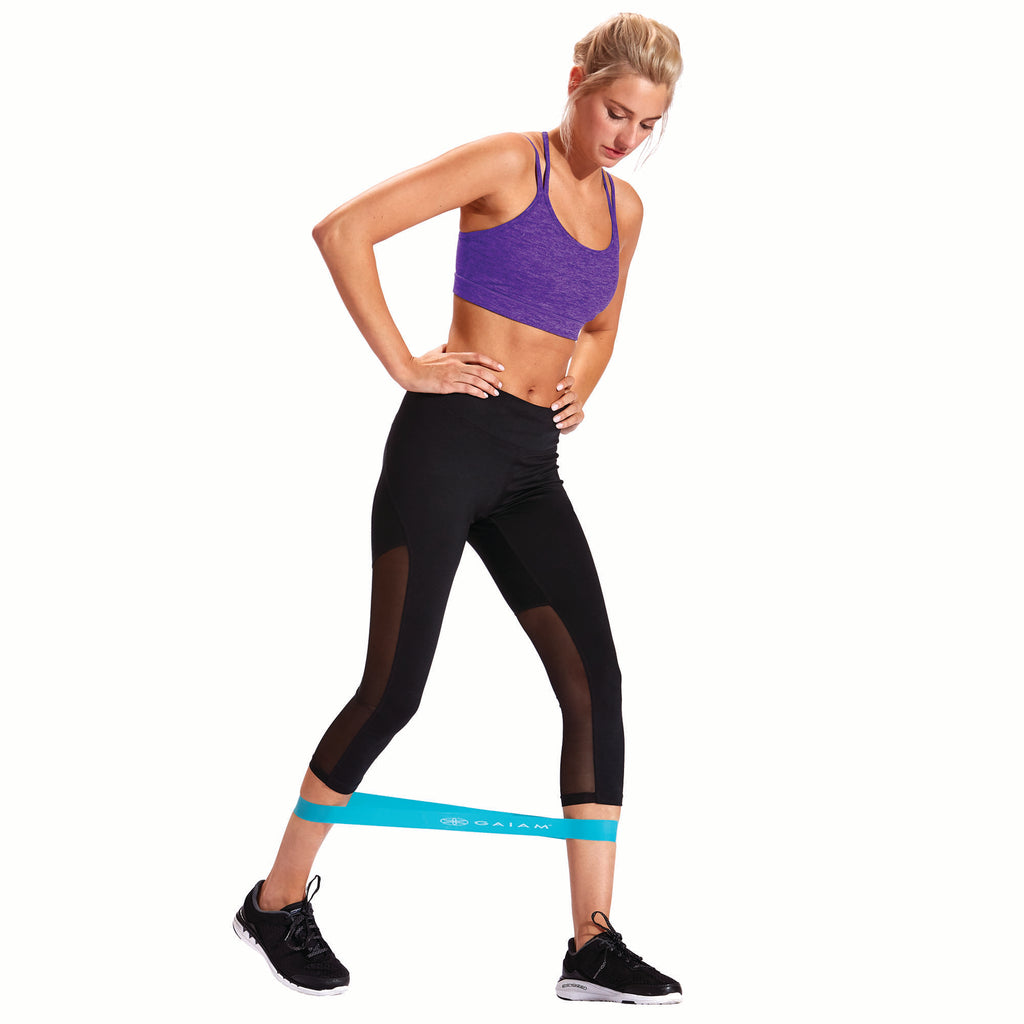 woman working out with the restore mini bands