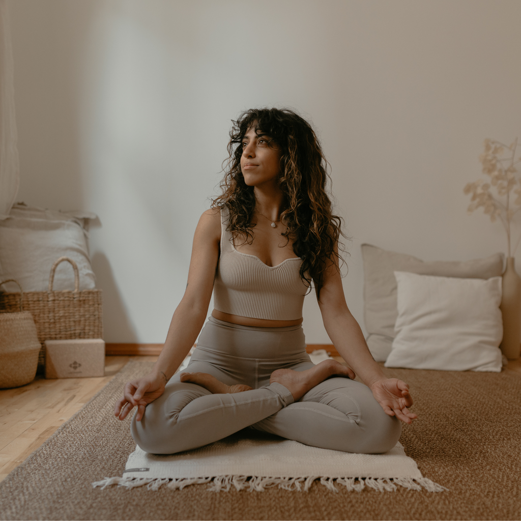 Woman sitting on Cotton Practice Rug