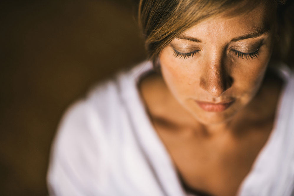 Woman with her eyes closed meditating