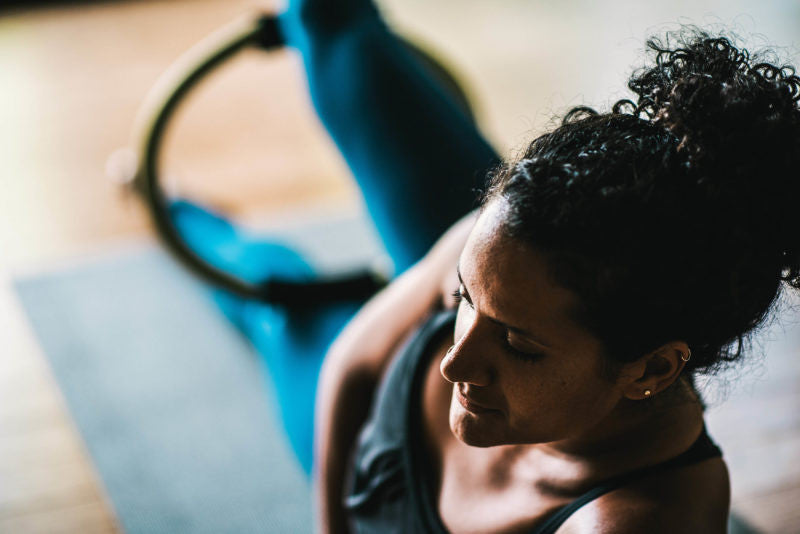Woman using a pilates ring