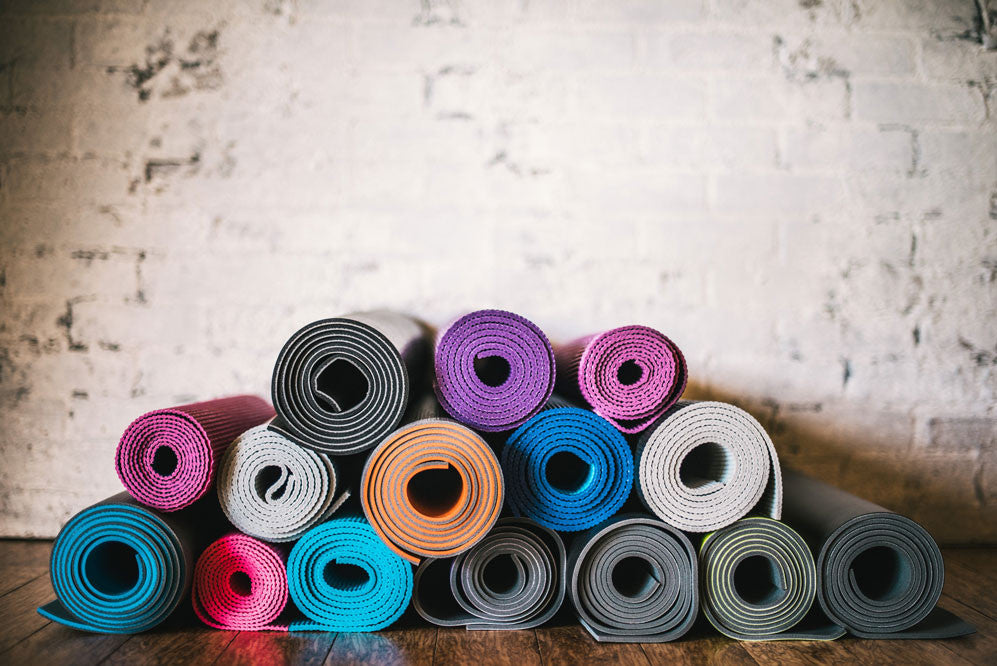 Yoga mats piled on top of each other