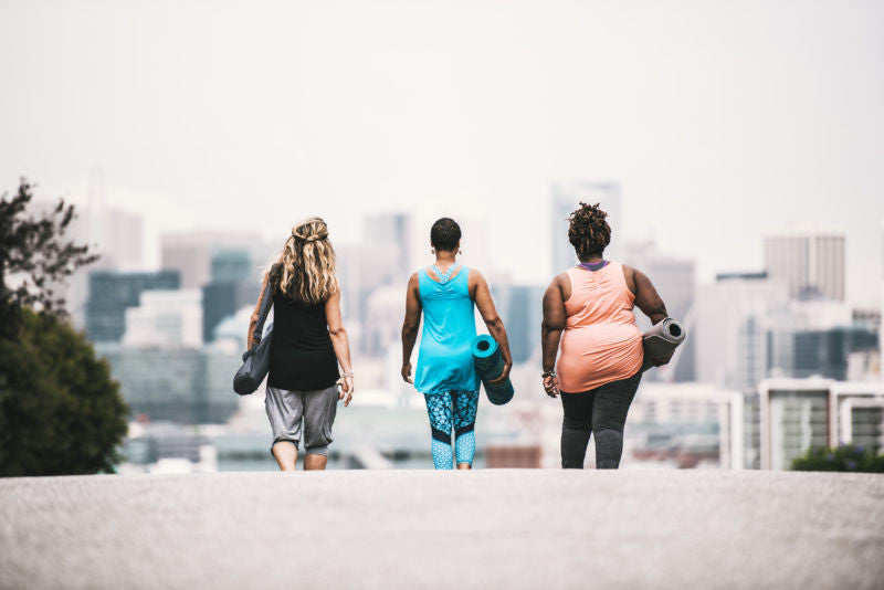Three women walking down the street