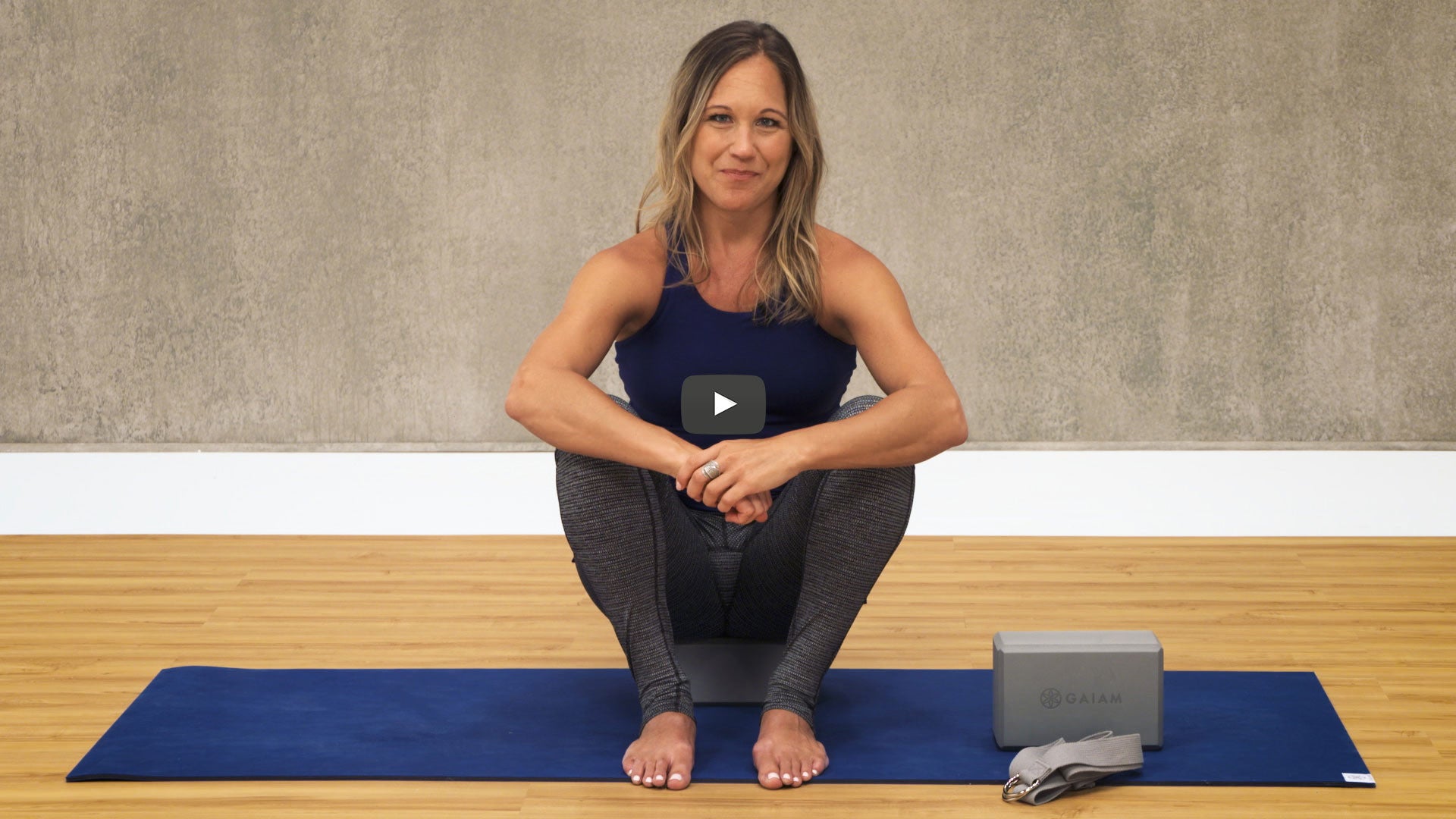 lady on yoga mats with props