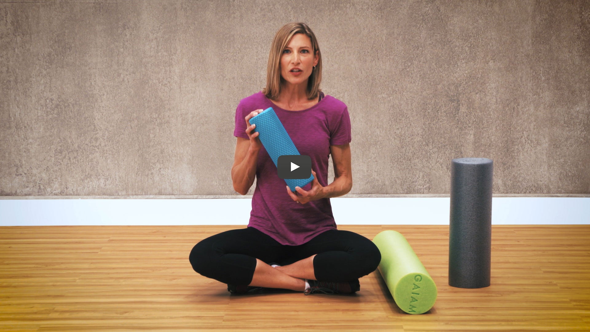 woman surrounded with foam rollers