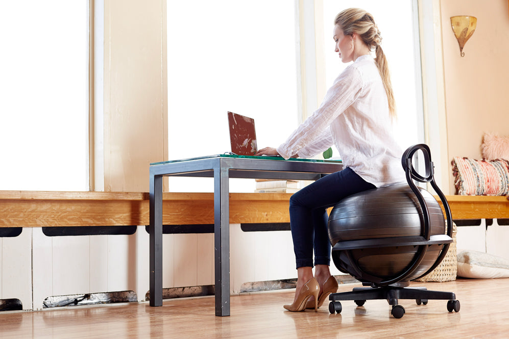 Blonde woman sitting at a desk 