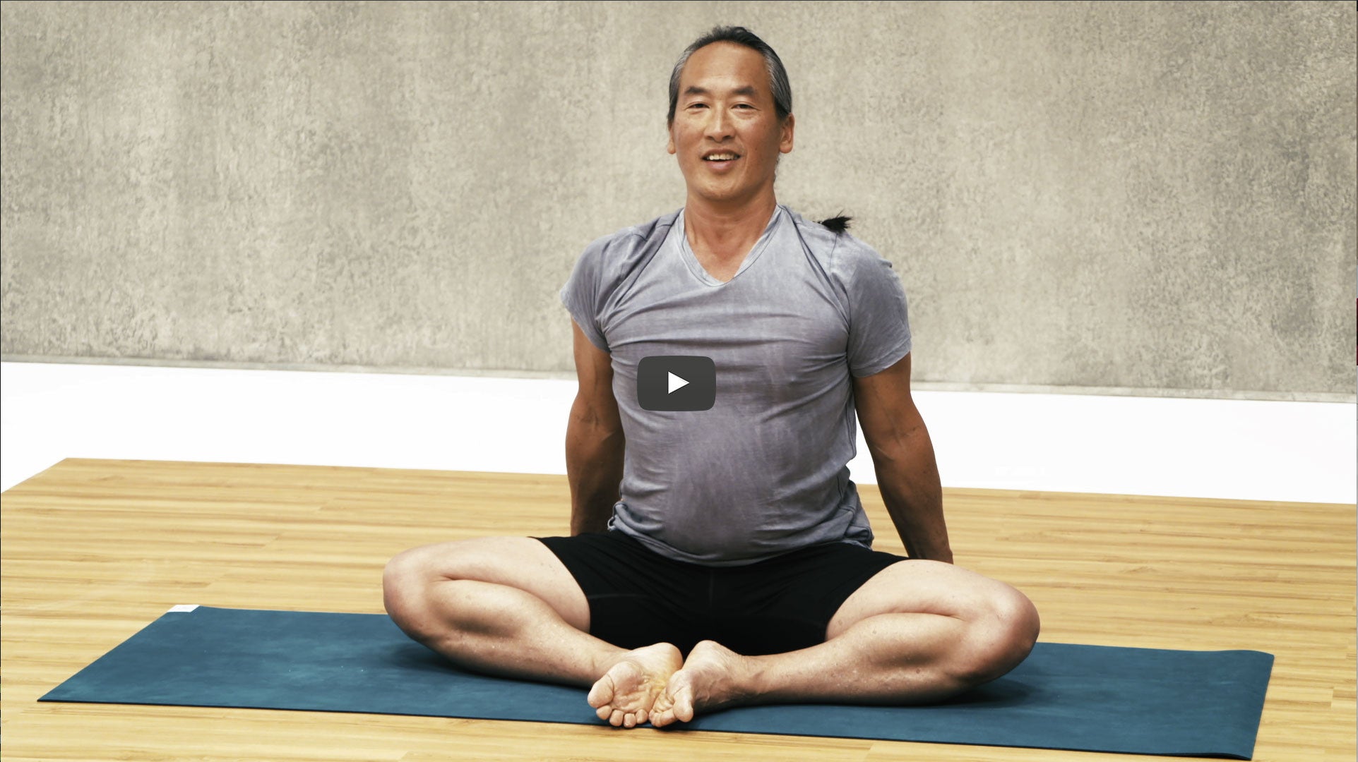Rodney Yee sits in butterfly pose