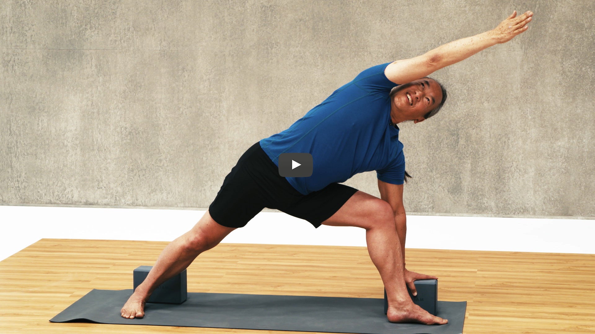 Rodney Yee does extended side angle pose