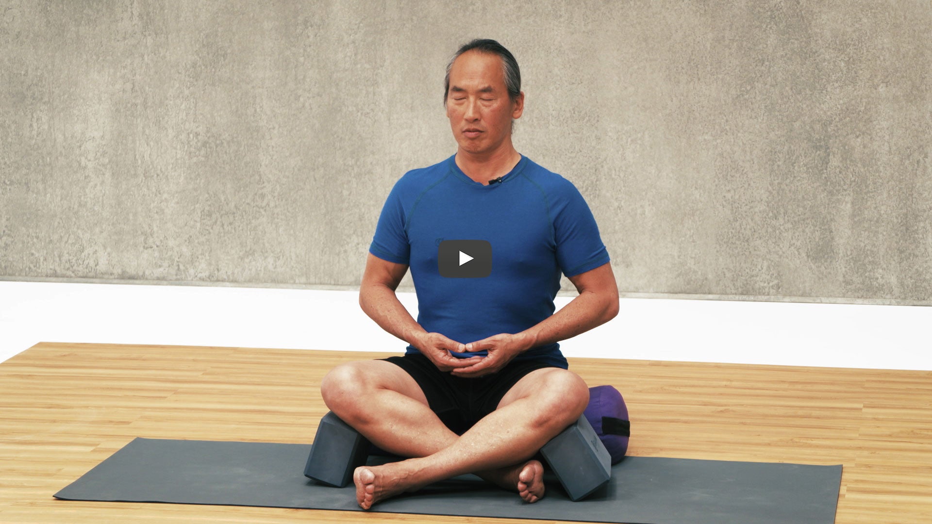 Rodney Yee sits in meditation