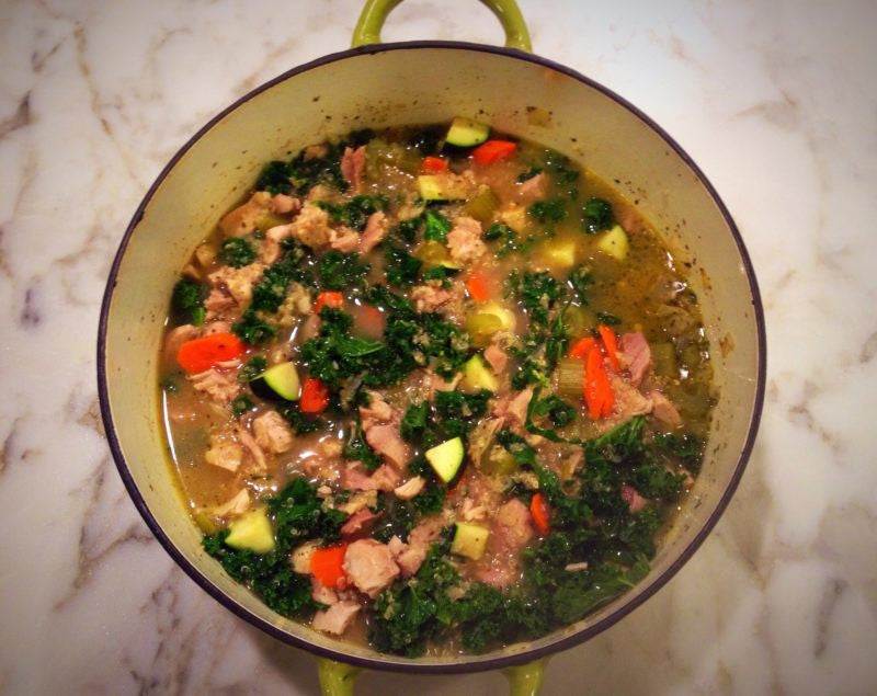 Pot of soup with veggies and meat 
