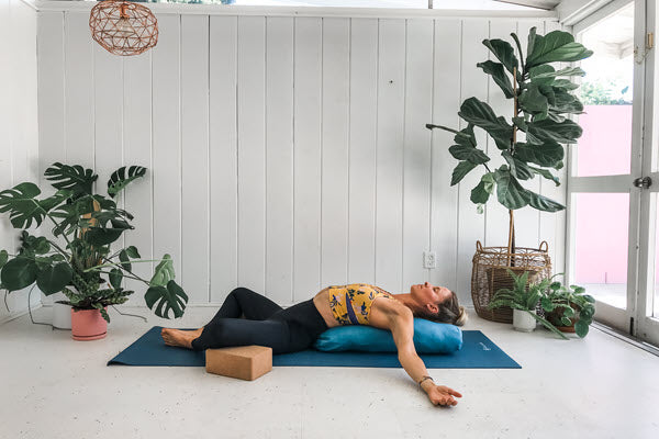 woman doing restorative yoga