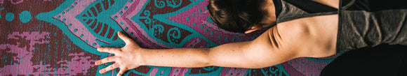 Two sided reversible yoga mats in a variety of prints and colors