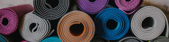 stack of yoga mats