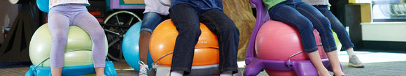 Kids sitting on balance ball chairs