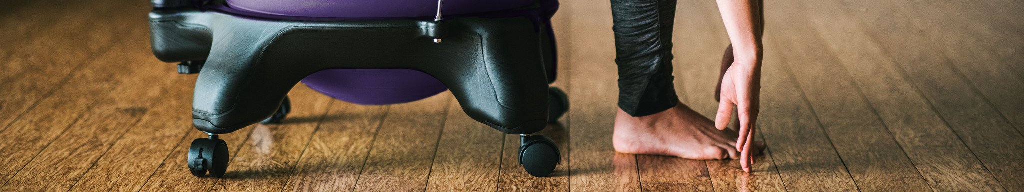 woman stretching on ball chair