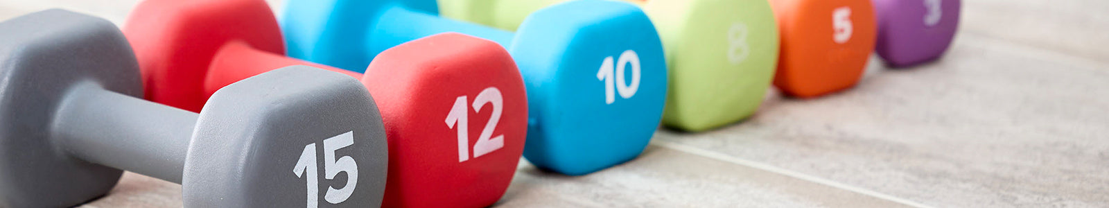 Row of hand weights in multiple colors