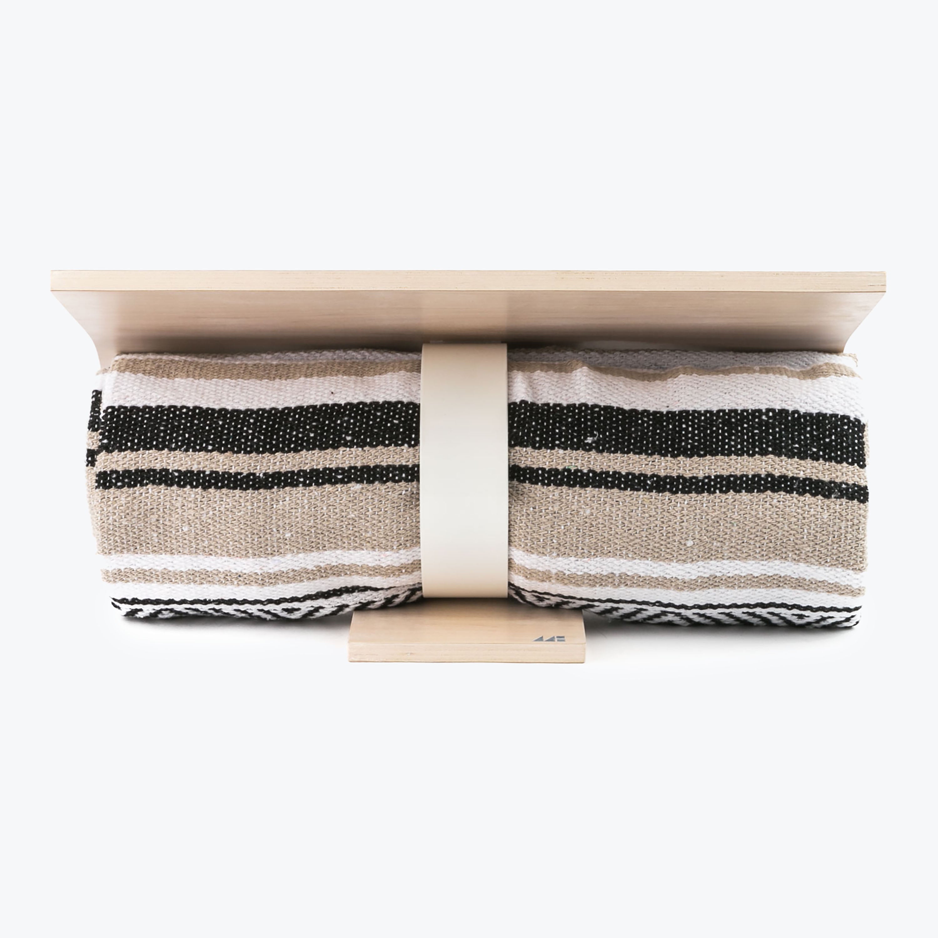 Meditation Hardware Woven Blanket in Tan and Grey Featured Beneath Meditation Bench